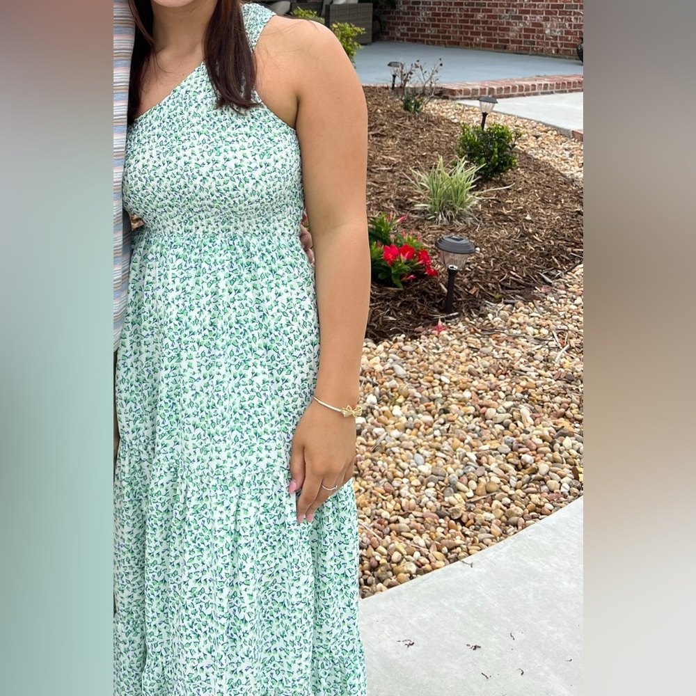 One shoulder green and blue floral dress.